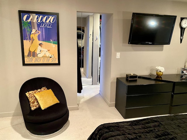 carpeted bedroom featuring baseboards