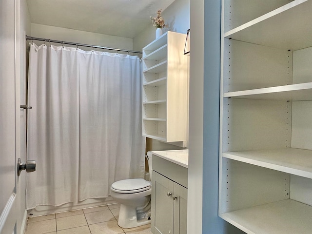 full bathroom with toilet, vanity, tile patterned floors, and shower / bathtub combination with curtain