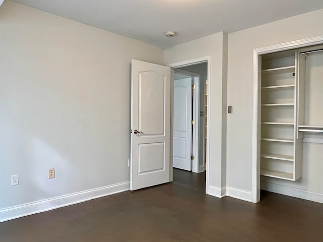 unfurnished bedroom featuring dark wood-type flooring