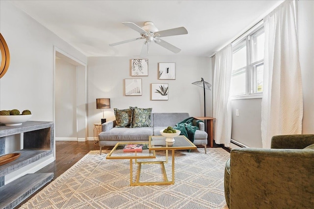 221 Terrace Ave, Jersey City, NJ 07307 - living area with wood finished floors, a ceiling fan, a baseboard radiator, and baseboards