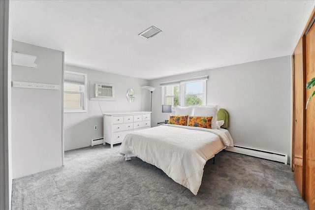 221 Terrace Ave, Jersey City, NJ 07307 - carpeted bedroom featuring a baseboard heating unit and an AC wall unit
