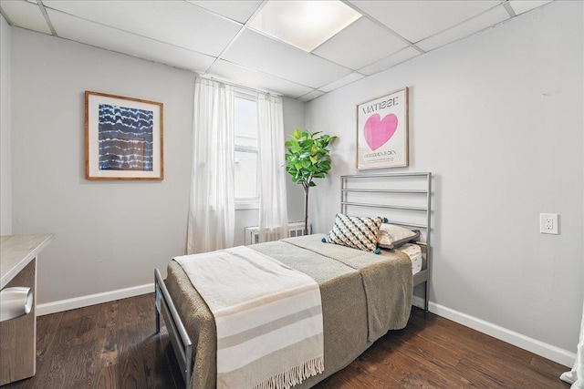221 Terrace Ave, Jersey City, NJ 07307 - bedroom with a paneled ceiling, baseboards, and dark wood-style floors