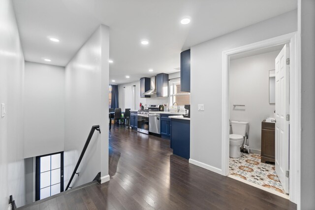 225 Freeman Ave, Jersey City, NJ 07306 - hall with dark wood-type flooring, baseboards, an upstairs landing, recessed lighting, and a sink