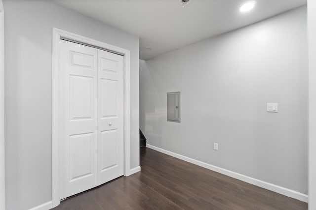 225 Freeman Ave, Jersey City, NJ 07306 - unfurnished bedroom featuring dark wood-type flooring, electric panel, recessed lighting, a closet, and baseboards