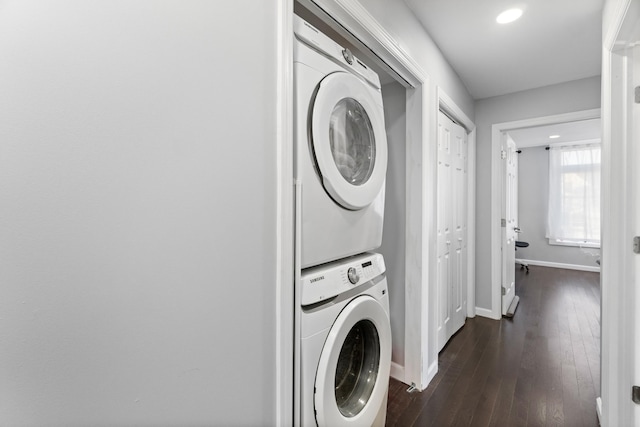 225 Freeman Ave, Jersey City, NJ 07306 - laundry area with recessed lighting, baseboards, dark wood-type flooring, and stacked washer and clothes dryer