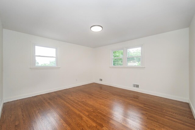 44 Grover Dr, Wayne, NJ 07470 - unfurnished room with plenty of natural light and dark wood-type flooring