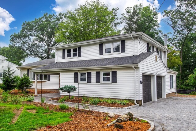 44 Grover Dr, Wayne, NJ 07470 - traditional-style home with decorative driveway, an attached garage, and roof with shingles
