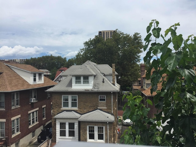 18 74th St Unit D5, North Bergen, NJ 07047 - view of front facade featuring a chimney, cooling unit, and brick siding