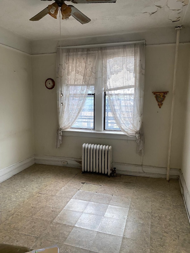 6414 Park Ave Unit 8, West New York, NJ 07093 - empty room featuring radiator and a ceiling fan