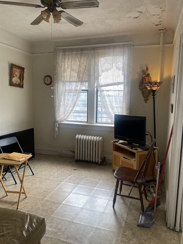 6414 Park Ave Unit 8, West New York, NJ 07093 - living room with radiator heating unit and ceiling fan