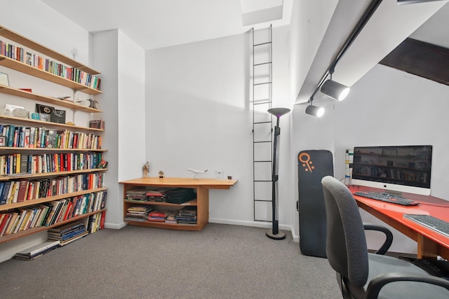 carpeted home office featuring baseboards