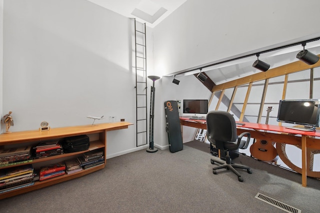 carpeted office with baseboards and visible vents