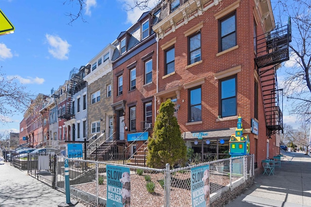 view of property with a residential view and a fenced front yard