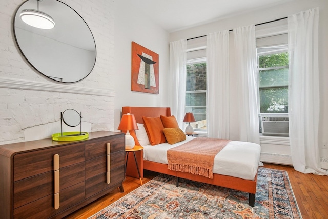 237 3rd St Unit 1, Jersey City, NJ 07302 - bedroom featuring wood-type flooring and cooling unit