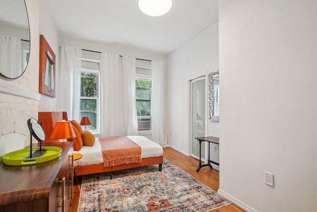 237 3rd St Unit 1, Jersey City, NJ 07302 - bedroom with wood finished floors and cooling unit