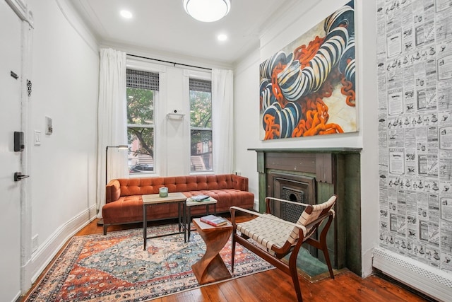 237 3rd St Unit 1, Jersey City, NJ 07302 - living area featuring wood finished floors, a fireplace, and ornamental molding