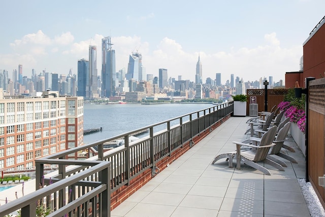 balcony with a city view and a water view