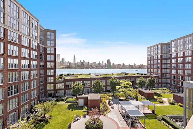 exterior space featuring a view of city and a water view