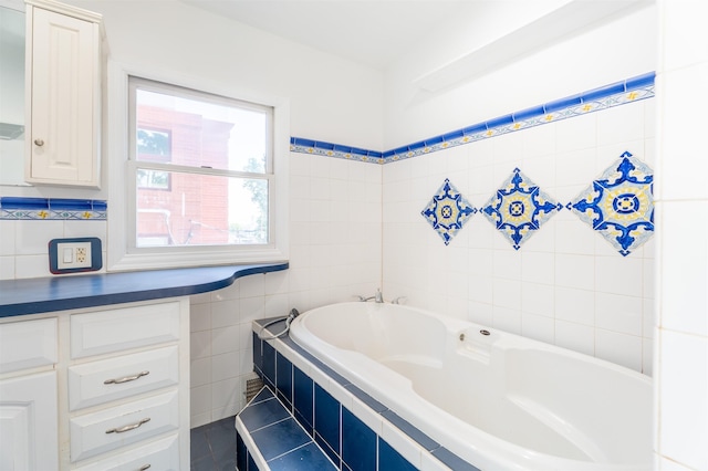 238 Undercliff Ave, Edgewater, NJ 07020 - bathroom featuring a garden tub, tile walls, and tile patterned floors