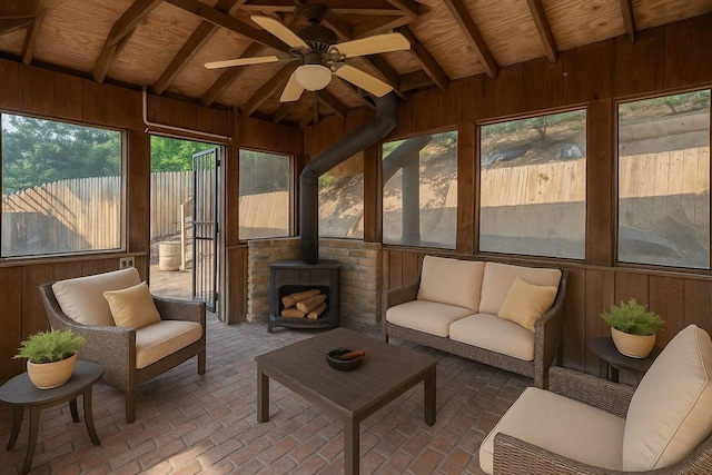 238 Undercliff Ave, Edgewater, NJ 07020 - sunroom / solarium with wooden walls, ceiling fan, wood ceiling, a wood stove, and outdoor lounge area