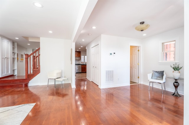 238 Undercliff Ave, Edgewater, NJ 07020 - living room featuring wood finished floors, stairs, recessed lighting, and healthy amount of natural light