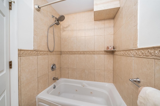 full bath featuring a combined bath / shower with jetted tub and tile walls