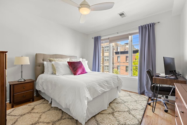 83 Monroe St Unit 3A, Hoboken, NJ 07030 - bedroom featuring baseboards, ceiling fan, light wood-style flooring, and visible vents