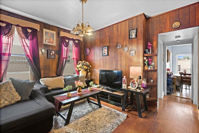58 Booraem Ave, Jersey City, NJ 07307 - living room with a chandelier, wooden walls, and wood-type flooring