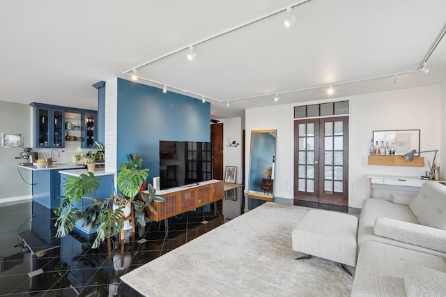 380 Mountain Rd Unit 1012, Union City, NJ 07087 - living room featuring rail lighting, french doors, and granite floors