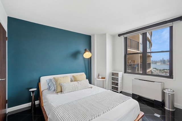 380 Mountain Rd Unit 1012, Union City, NJ 07087 - tiled bedroom featuring radiator and baseboards