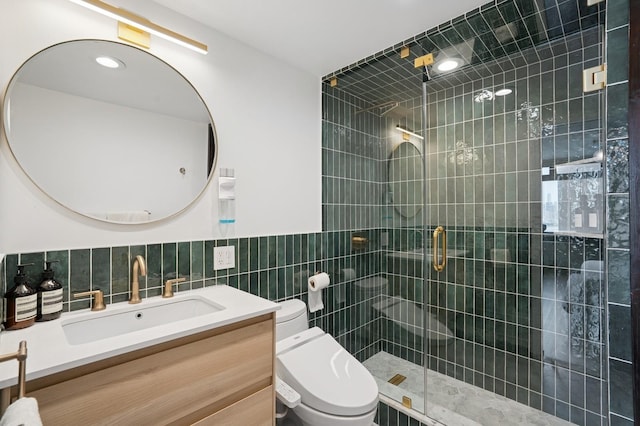 380 Mountain Rd Unit 1012, Union City, NJ 07087 - bathroom with tile walls, a stall shower, vanity, and a wainscoted wall