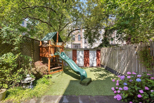 908 Garden St Unit 1, Hoboken, NJ 07030 - view of play area with a fenced backyard