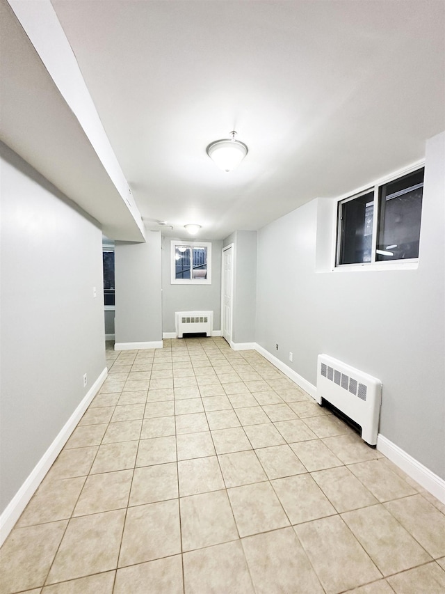 552 38th St Unit B4, Union City, NJ 07086 - finished below grade area with radiator and light tile patterned floors