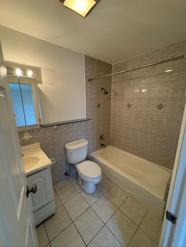 1502 44th St, North Bergen, NJ 07047 - bathroom with tile patterned floors, tile walls, toilet, vanity, and shower / tub combination