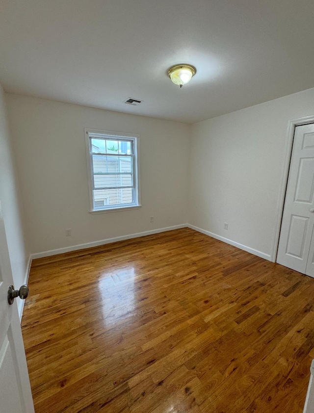 1502 44th St, North Bergen, NJ 07047 - unfurnished room with wood finished floors and baseboards