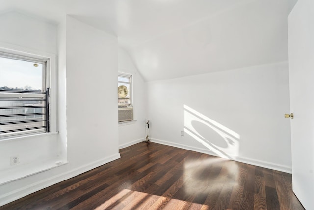 bonus room featuring dark hardwood / wood-style floors and lofted ceiling