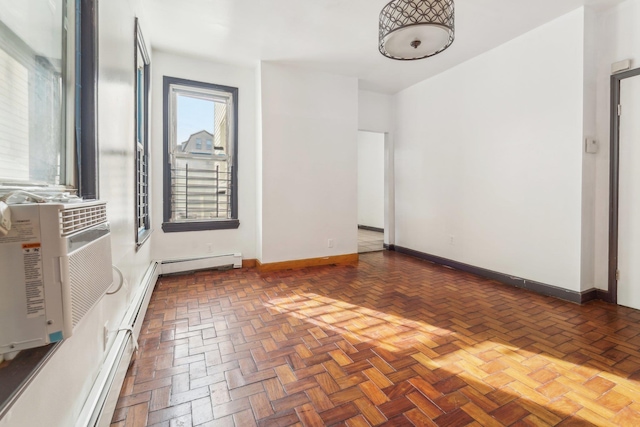 unfurnished room featuring dark parquet flooring