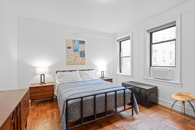 bedroom featuring cooling unit and baseboards