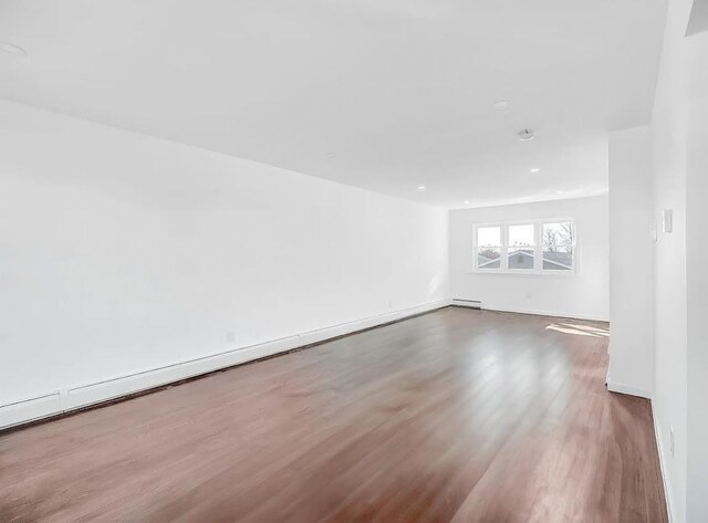 21 Freedom Pl, Jersey City, NJ 07065 - unfurnished room featuring wood finished floors, baseboards, and recessed lighting