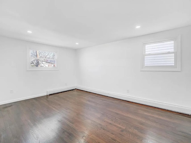 21 Freedom Pl, Jersey City, NJ 07065 - unfurnished room with wood finished floors, recessed lighting, and baseboards