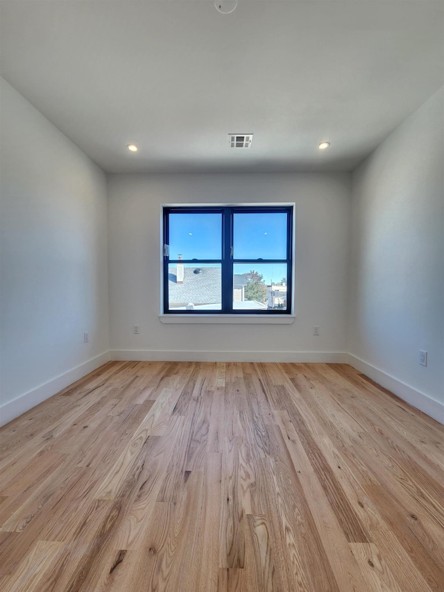 unfurnished room featuring light hardwood / wood-style flooring