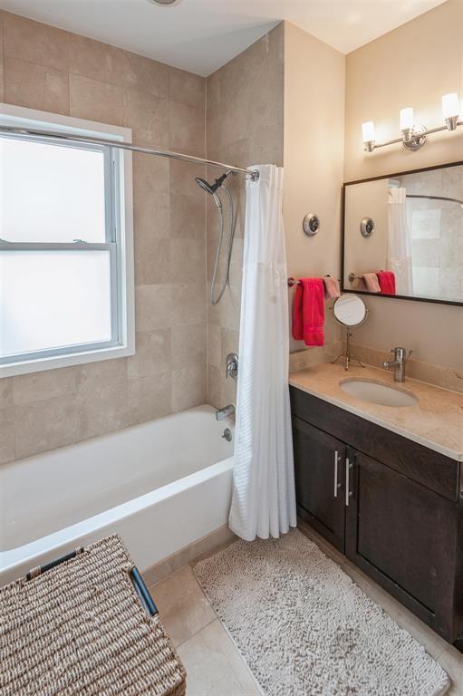 112 Liberty View Dr Unit 2A, Jersey City, NJ 07302 - full bathroom featuring vanity, shower / bath combo, and tile patterned flooring