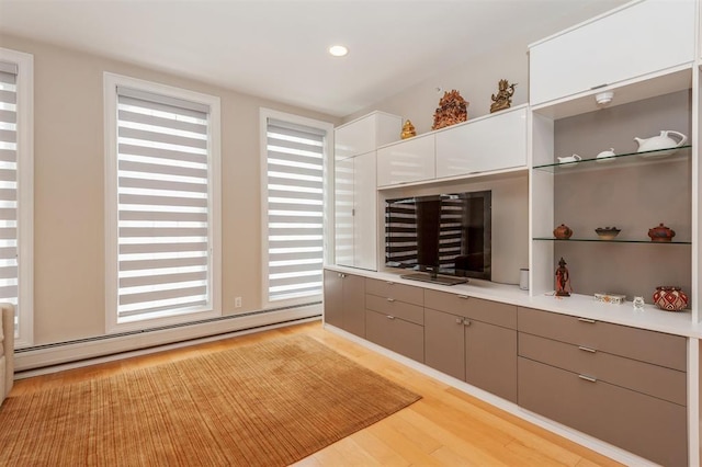 112 Liberty View Dr Unit 2A, Jersey City, NJ 07302 - kitchen featuring a baseboard heating unit, healthy amount of natural light, light wood finished floors, and recessed lighting