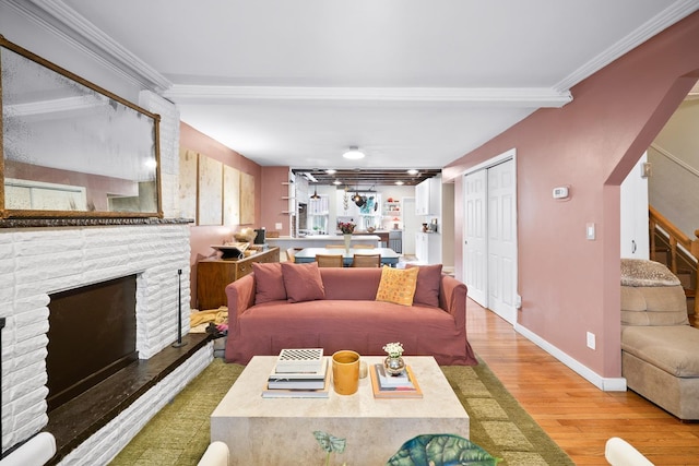 233 Summit Ave, Jersey City, NJ 07304 - living area featuring a fireplace, wood finished floors, ornamental molding, and stairs