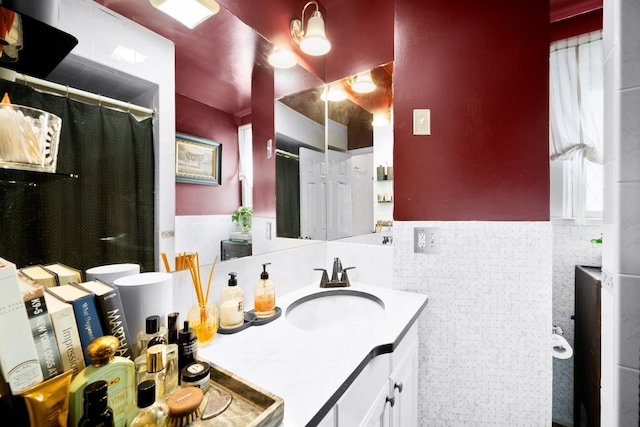 233 Summit Ave, Jersey City, NJ 07304 - bathroom with vanity, tile walls, a wainscoted wall, and a shower with shower curtain