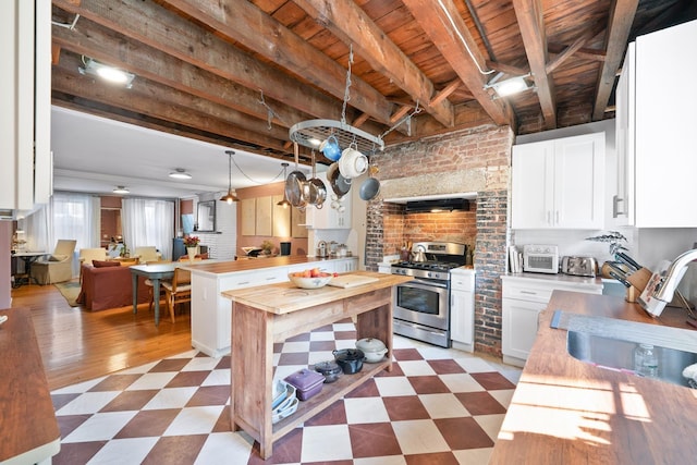 233 Summit Ave, Jersey City, NJ 07304 - kitchen featuring wooden counters, stainless steel range with gas cooktop, light floors, a wood ceiling with exposed beams, and exhaust hood