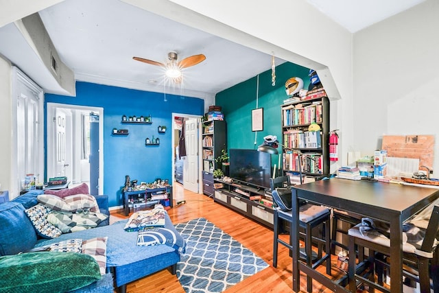 233 Summit Ave, Jersey City, NJ 07304 - living room featuring wood finished floors, a ceiling fan, and a desk