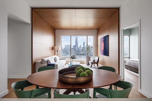 99 Hudson St Unit 3708, Jersey City, NJ 07302 - dining space with baseboards, wood finished floors, and a view of city