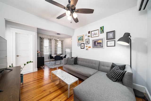 34 Romaine Ave Unit 2, Jersey City, NJ 07306 - living area featuring light wood-type flooring, ceiling fan, and a wall mounted air conditioner
