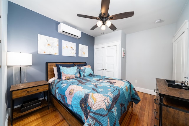 34 Romaine Ave Unit 2, Jersey City, NJ 07306 - bedroom with a wall unit AC, wood-type flooring, a closet, and a ceiling fan